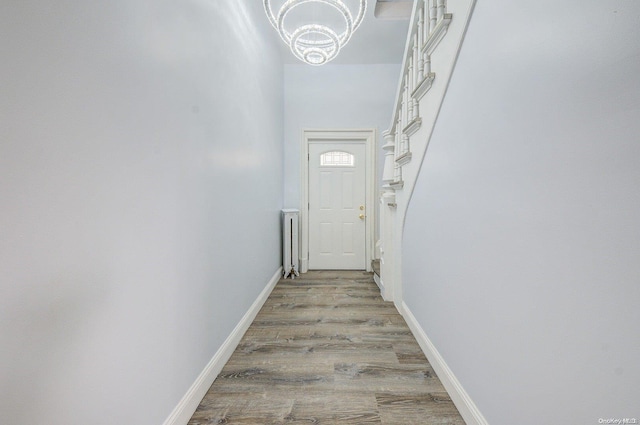 entryway featuring a notable chandelier and light hardwood / wood-style flooring