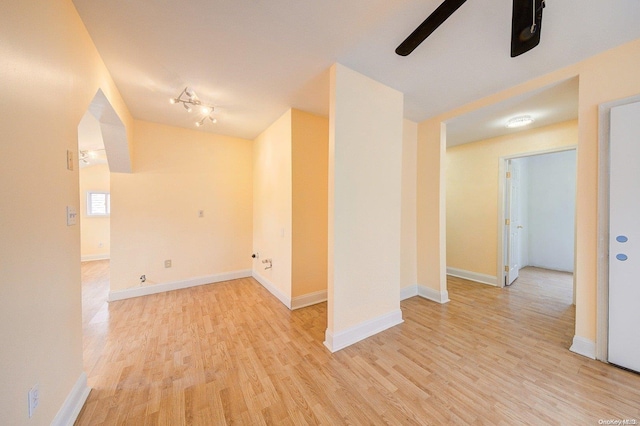 unfurnished room featuring ceiling fan and light hardwood / wood-style floors