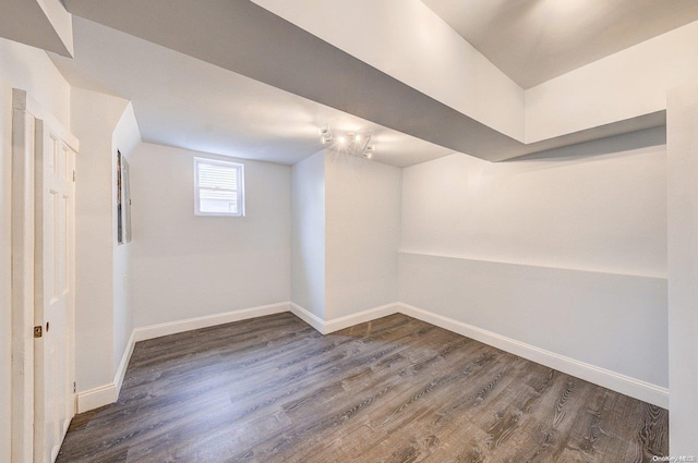 basement with dark wood-type flooring