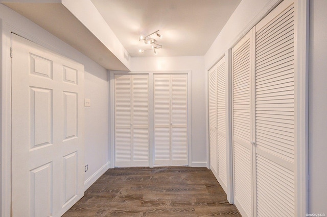 hallway featuring dark wood-type flooring