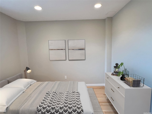 bedroom with light hardwood / wood-style floors