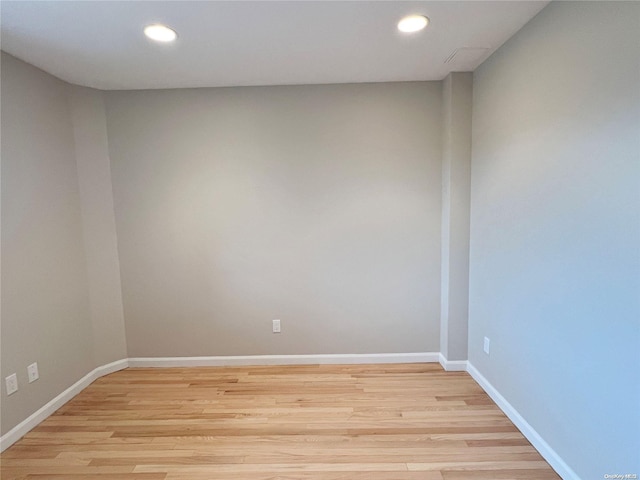 unfurnished room with light hardwood / wood-style floors