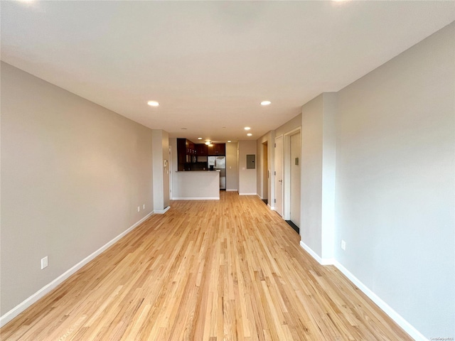 unfurnished living room with light wood-type flooring