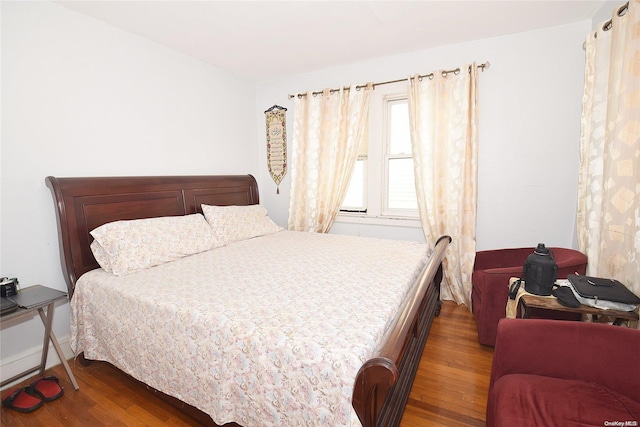 bedroom featuring dark wood-type flooring