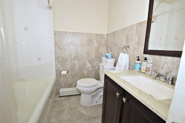 bathroom with toilet, vanity, tile walls, and a baseboard heating unit