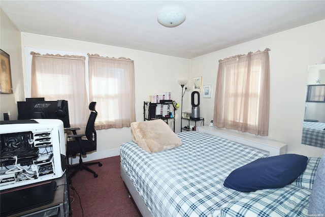 bedroom featuring dark colored carpet