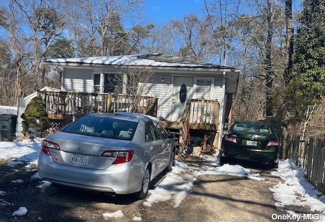 view of front of home with a wooden deck