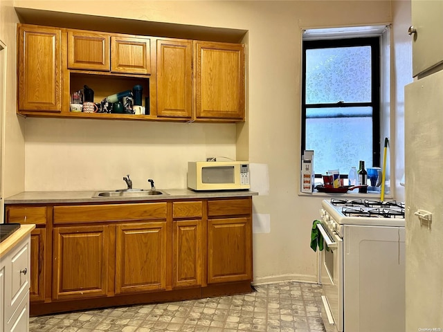 kitchen with white appliances and sink