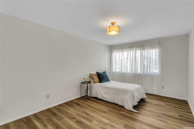 bedroom featuring wood-type flooring