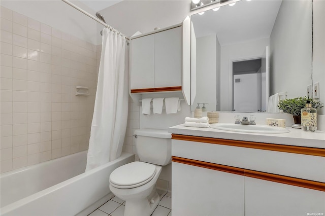 full bathroom with tile patterned flooring, vanity, toilet, and shower / bath combo with shower curtain