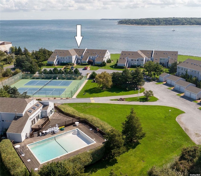 birds eye view of property with a water view