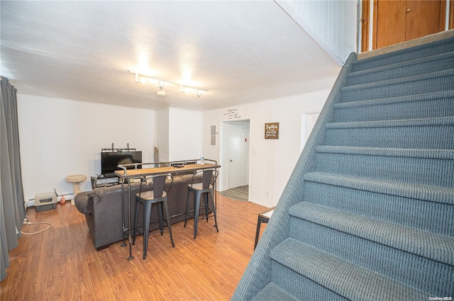 31 William St, Copiague, NY 11726 - living room with wood finished floors and stairs
