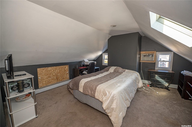 carpeted bedroom with lofted ceiling with skylight and a wall mounted air conditioner