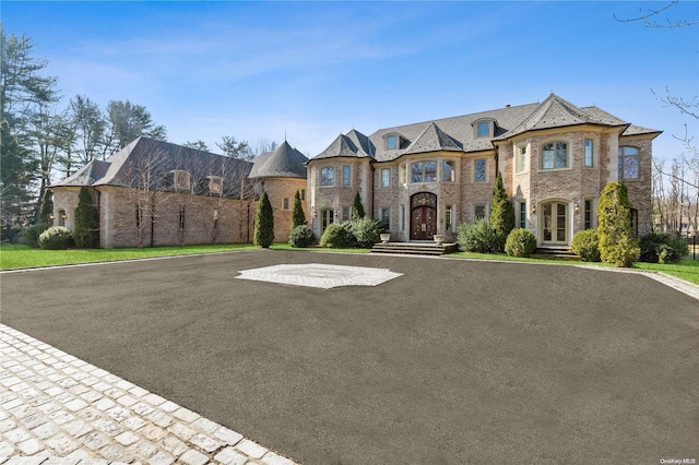 french country inspired facade with french doors