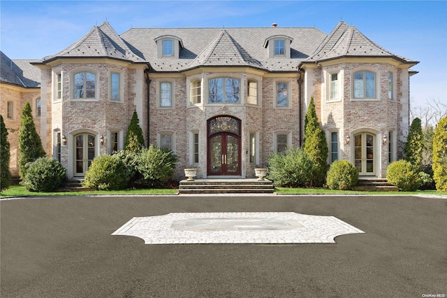 french country home featuring french doors