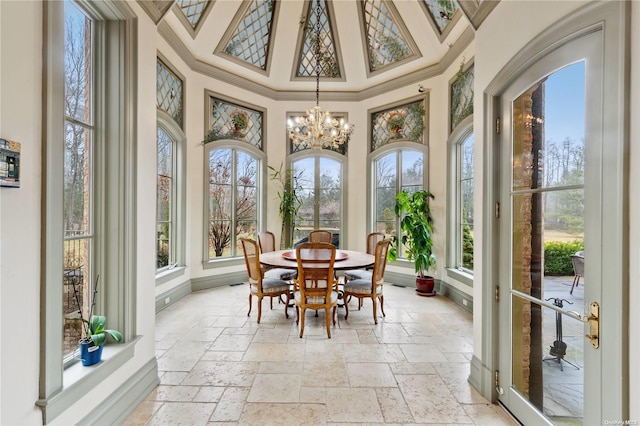 sunroom / solarium with an inviting chandelier and a wealth of natural light