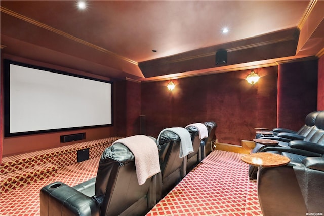 cinema room featuring crown molding and carpet