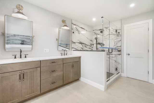 bathroom featuring vanity and a shower with shower door