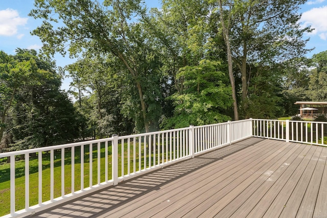 wooden deck with a yard