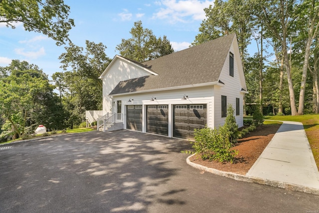 view of property exterior with a garage