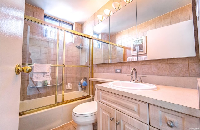 full bathroom featuring decorative backsplash, combined bath / shower with glass door, tile walls, and toilet