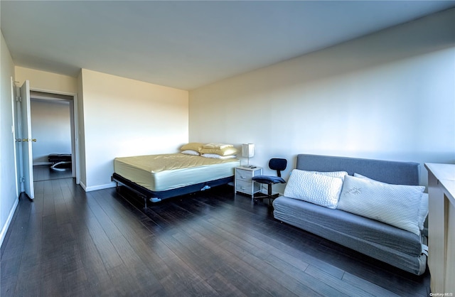 bedroom featuring dark wood-type flooring