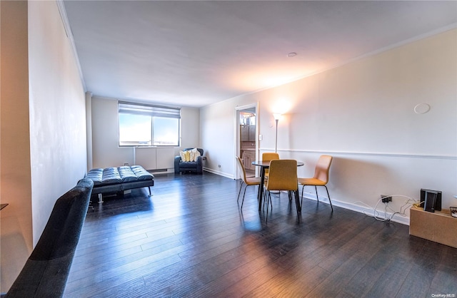 interior space with dark hardwood / wood-style flooring and crown molding