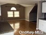 kitchen featuring white cabinetry and dark hardwood / wood-style flooring