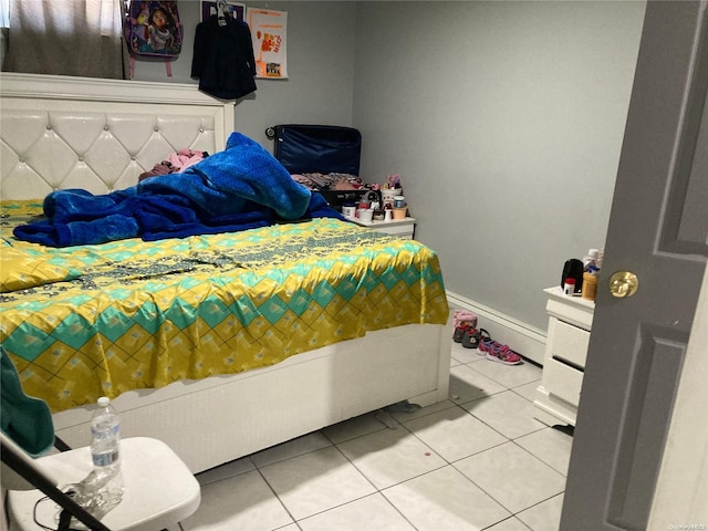 bedroom featuring tile patterned flooring