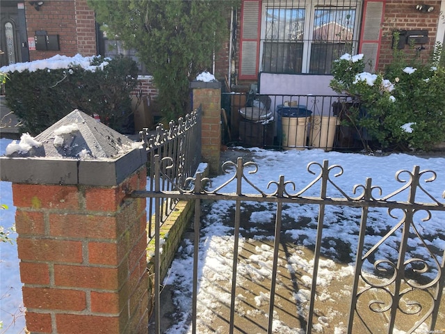 view of snow covered gate