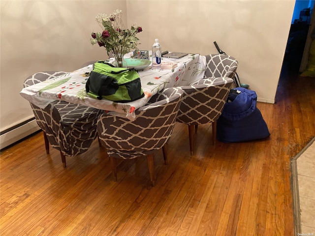 dining space featuring hardwood / wood-style flooring