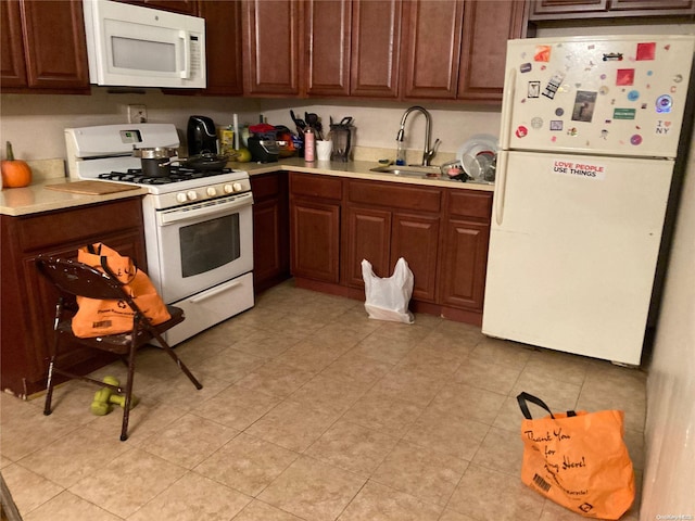 kitchen with white appliances and sink