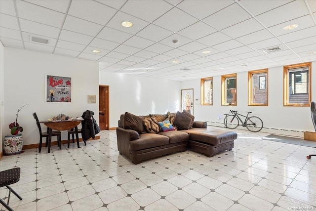 living room featuring a paneled ceiling