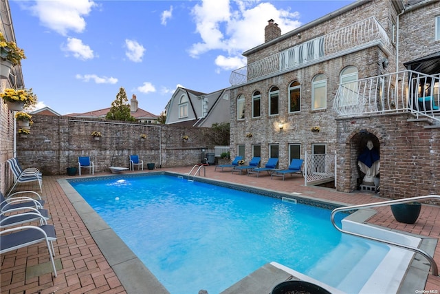 view of swimming pool featuring a patio