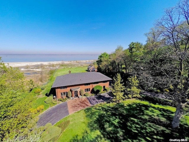 drone / aerial view with a water view and a view of the beach