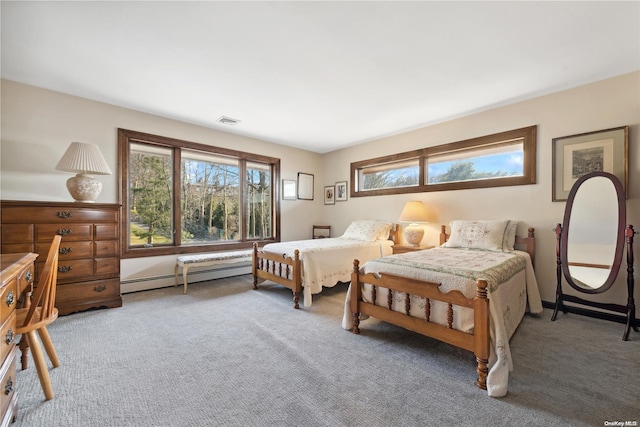 carpeted bedroom featuring a baseboard radiator