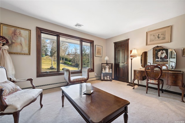 living room with light carpet and a baseboard heating unit