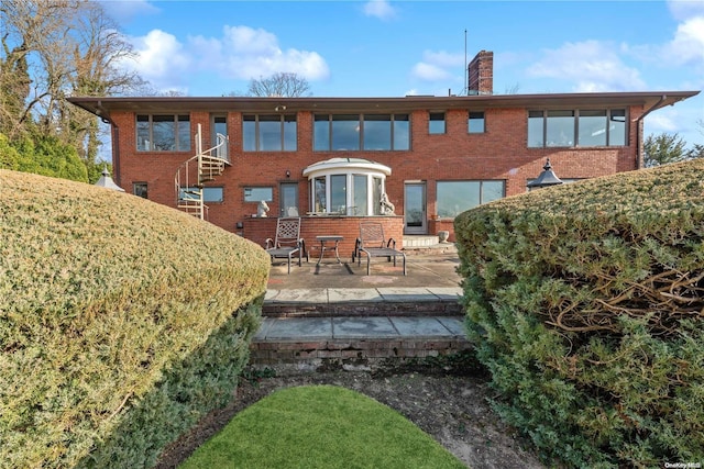 back of house featuring a patio area