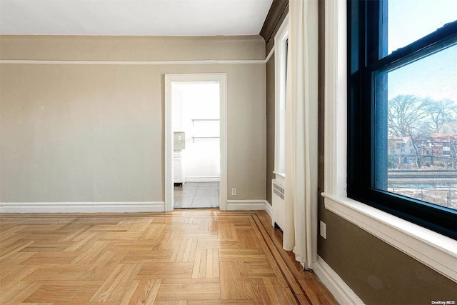 unfurnished room featuring light parquet floors