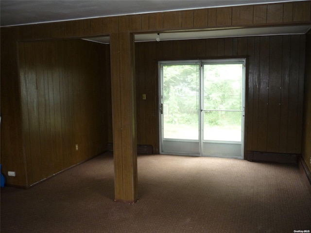 1449 Grand Ave, North Baldwin, NY 11510 - carpeted spare room with wooden walls