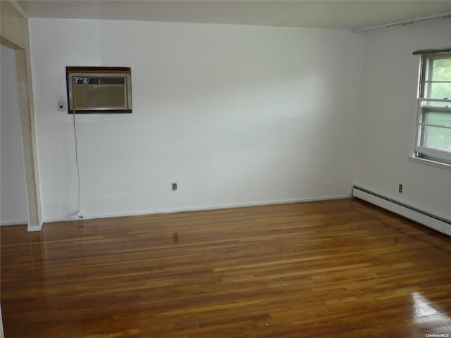 1449 Grand Ave, North Baldwin, NY 11510 - spare room with dark hardwood / wood-style flooring, a baseboard radiator, and a wall mounted air conditioner