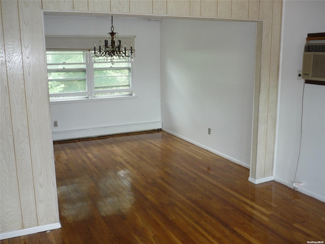 1449 Grand Ave, North Baldwin, NY 11510 - unfurnished dining area with a notable chandelier, dark hardwood / wood-style floors, and a baseboard heating unit
