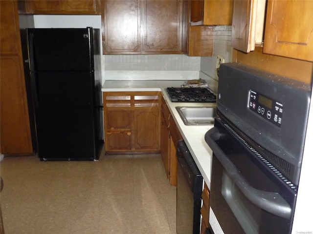 1449 Grand Ave, North Baldwin, NY 11510 - kitchen featuring black appliances and tasteful backsplash