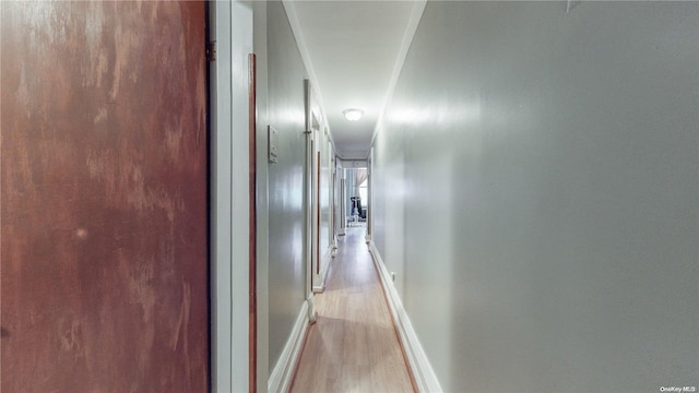 corridor featuring light hardwood / wood-style flooring