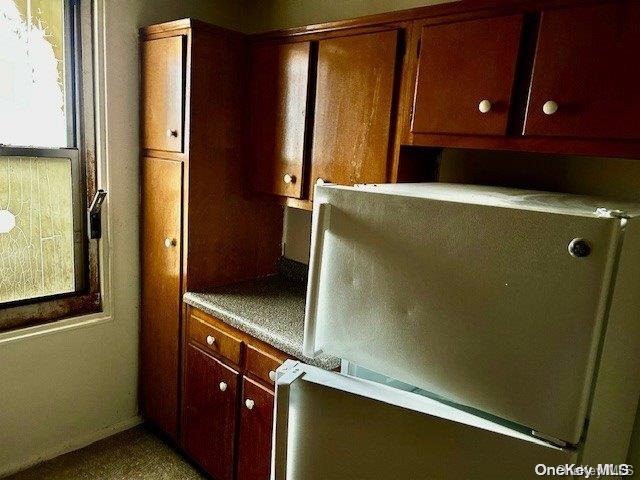 kitchen featuring refrigerator