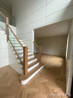 stairway with parquet flooring