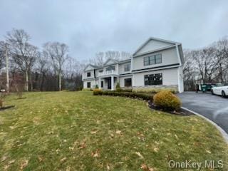 view of property with a front lawn