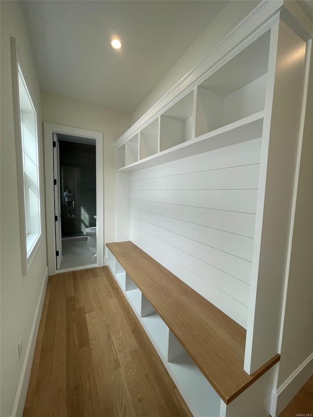 mudroom featuring recessed lighting, baseboards, and wood finished floors