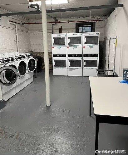 basement with washer and dryer and stacked washer and clothes dryer