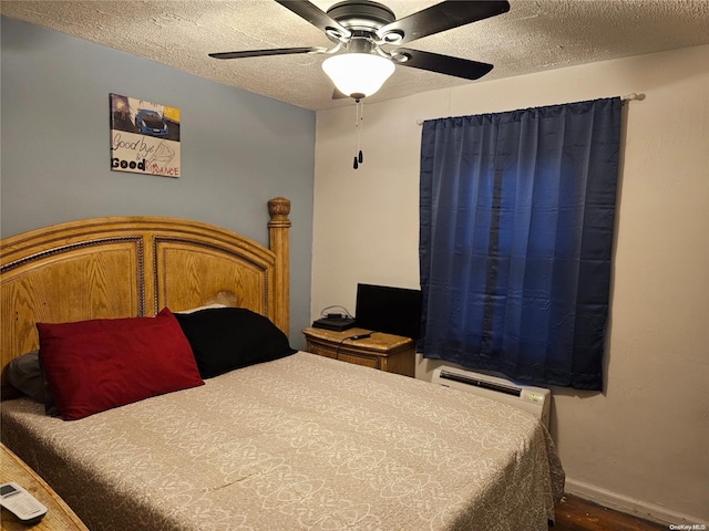 bedroom featuring baseboards, a textured ceiling, and ceiling fan